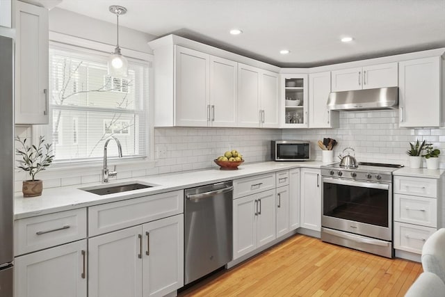 kitchen featuring sink, white cabinetry, and appliances with stainless steel finishes