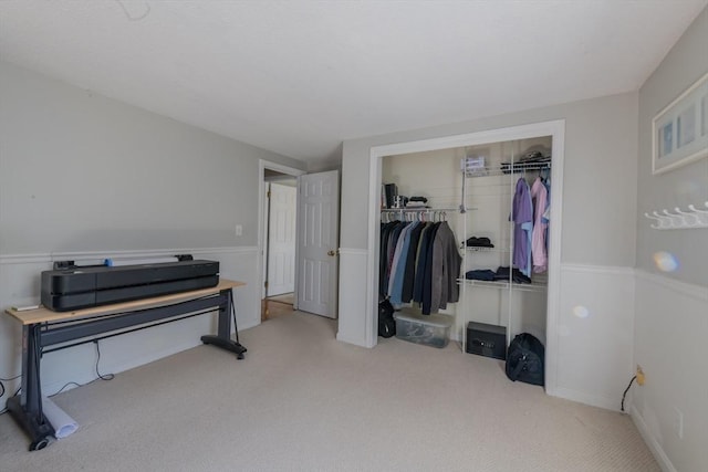 bedroom featuring a closet and carpet floors