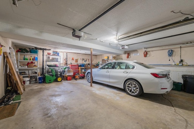 garage featuring a garage door opener