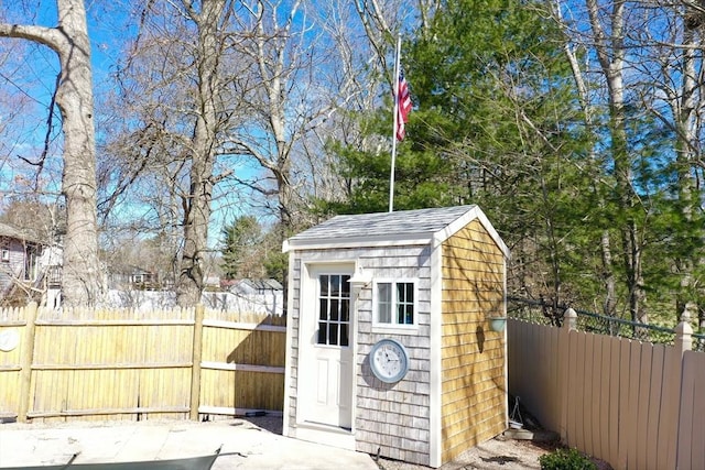 view of shed featuring a fenced backyard