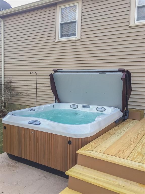 deck with a hot tub