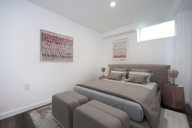 bedroom featuring recessed lighting, dark wood finished floors, and baseboards