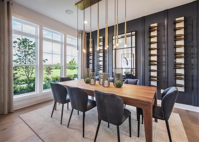 dining space featuring light wood-type flooring