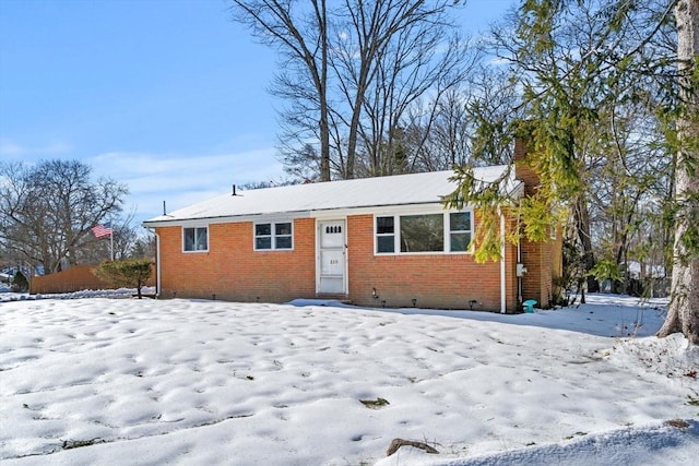 view of front of home featuring crawl space and brick siding