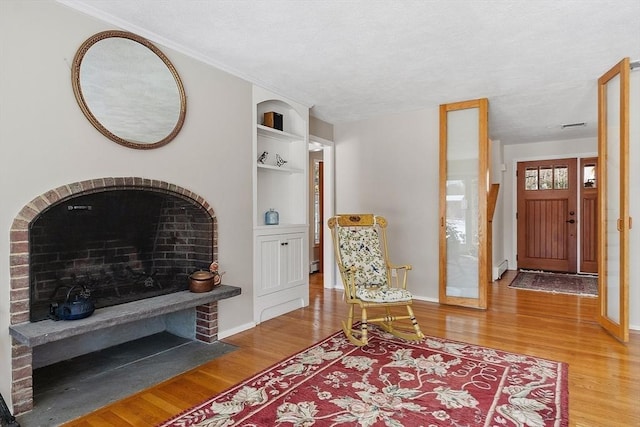 foyer featuring wood finished floors and baseboards