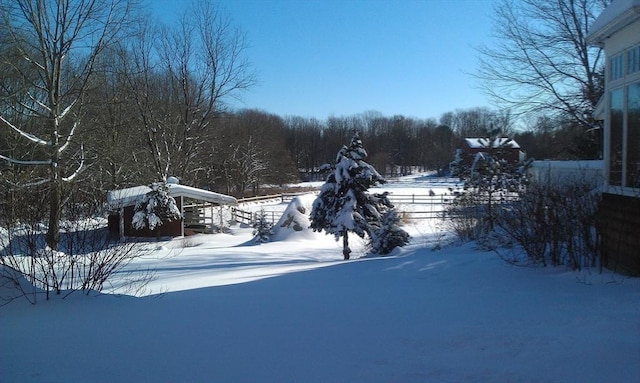 view of yard layered in snow