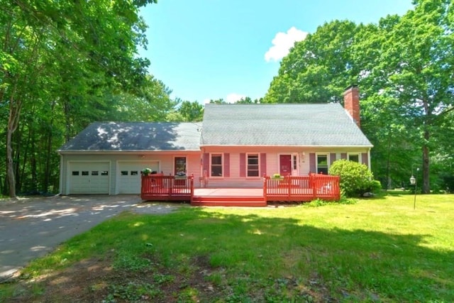 82 Prince Rd, Southbridge, MA 01550 - cape cod house featuring a garage, a chimney, driveway, a front lawn, and a deck