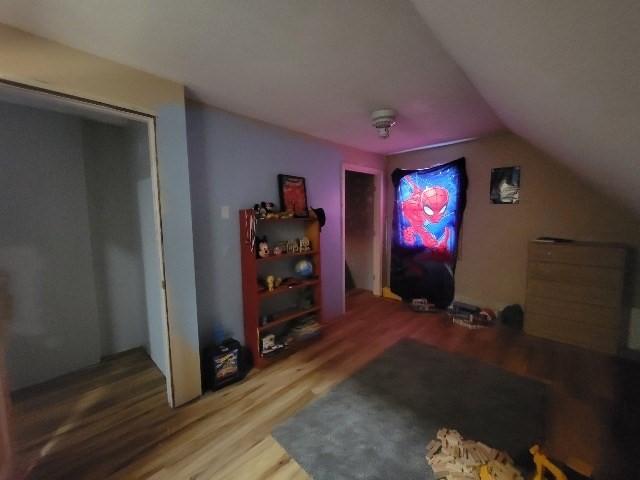 82 Prince Rd, Southbridge, MA 01550 - home theater room with wood finished floors and vaulted ceiling