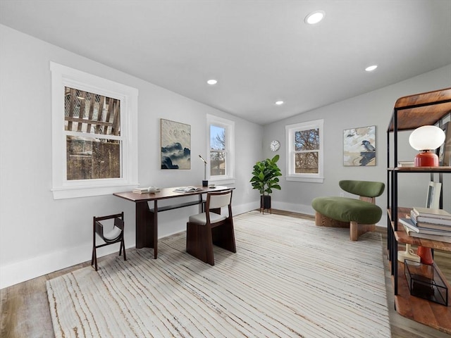 home office with lofted ceiling, light wood finished floors, baseboards, and recessed lighting