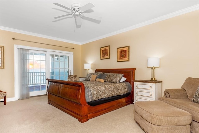 carpeted bedroom featuring access to exterior, ceiling fan, and crown molding