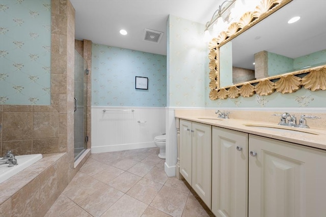 full bathroom featuring tile patterned flooring, vanity, toilet, and plus walk in shower