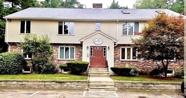 32 Hilltop Ln Unit 2, Easton, MA 02375 - view of front of home with brick siding and a chimney