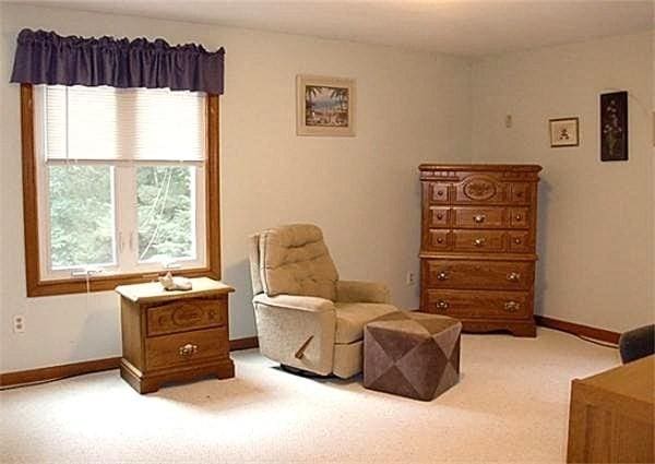 32 Hilltop Ln Unit 2, Easton, MA 02375 - sitting room with light colored carpet and baseboards
