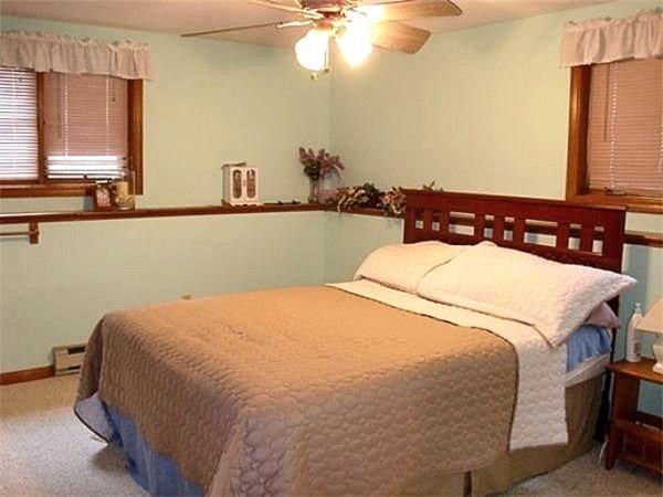 32 Hilltop Ln Unit 2, Easton, MA 02375 - carpeted bedroom with ceiling fan and baseboards