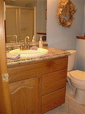 32 Hilltop Ln Unit 2, Easton, MA 02375 - bathroom with vanity, tile patterned flooring, and a shower with door