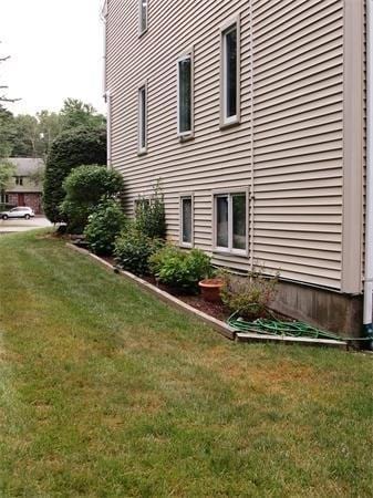 32 Hilltop Ln Unit 2, Easton, MA 02375 - view of property exterior with a lawn