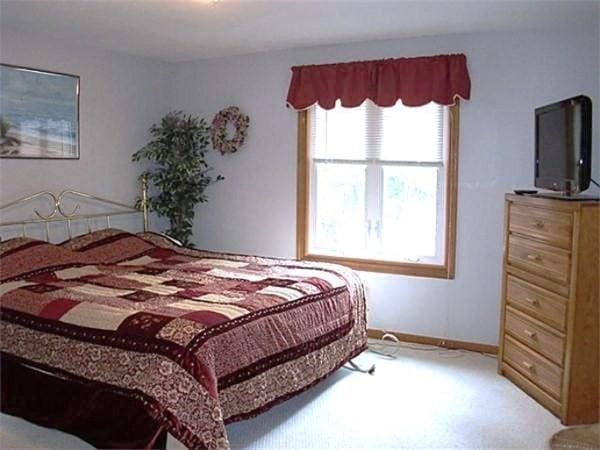 32 Hilltop Ln Unit 2, Easton, MA 02375 - carpeted bedroom with baseboards