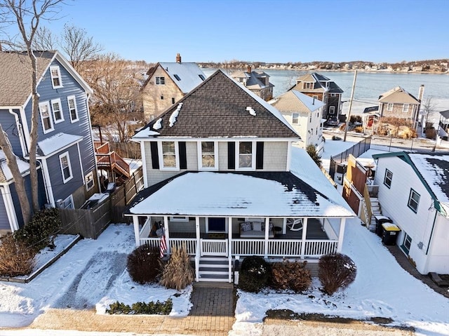 view of front of home with a water view and a porch