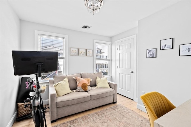 living room with light hardwood / wood-style floors