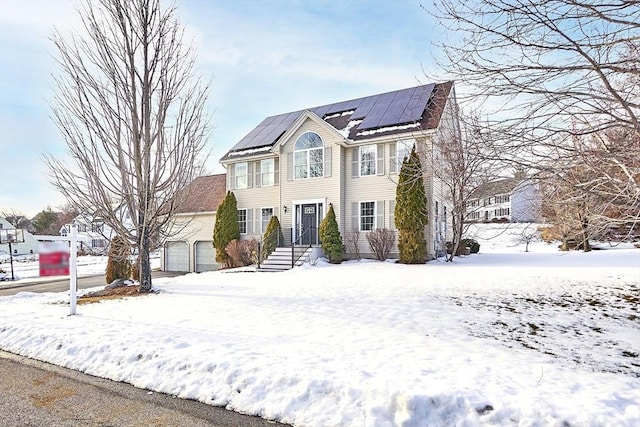 view of front of property with solar panels