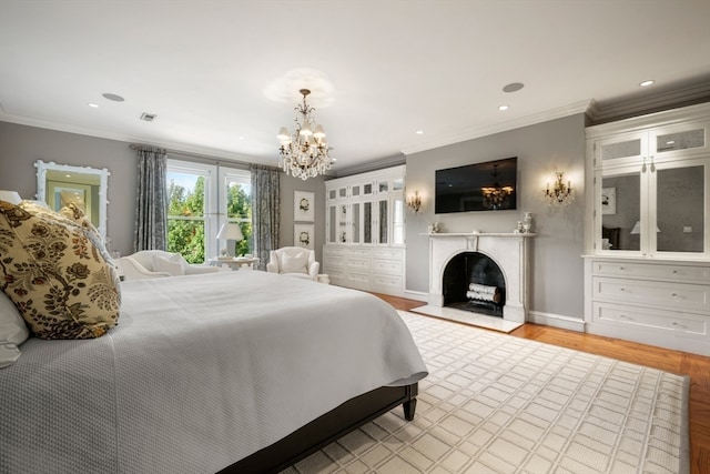 bedroom with crown molding, light hardwood / wood-style flooring, and an inviting chandelier