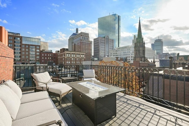 36 Commonwealth Ave Unit 2, Boston, MA 02116 - view of patio with a view of skyline and an outdoor living space with a fire pit