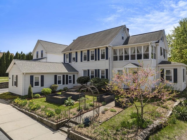 colonial house with a garden