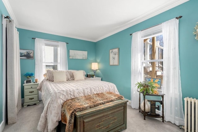 bedroom featuring radiator, light carpet, and crown molding
