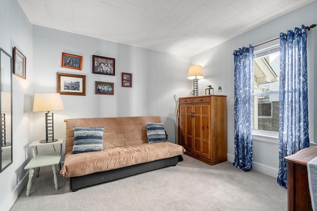 living area with carpet floors and baseboards