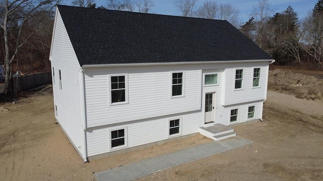 bi-level home with roof with shingles