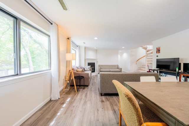 19 Burnham St Unit C2, Belmont, MA 02478 - dining room with healthy amount of natural light, stairway, light wood-type flooring, baseboards, and recessed lighting