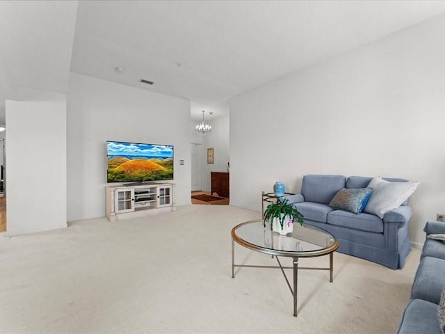 carpeted living area with a notable chandelier and visible vents