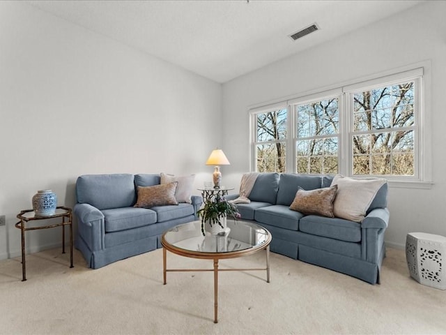 living room featuring visible vents and carpet flooring