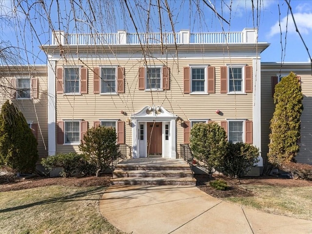 view of front of house featuring a chimney