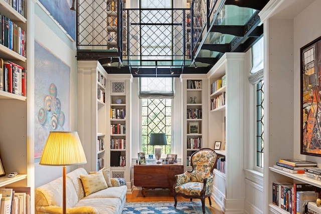 sitting room featuring a wealth of natural light and hardwood / wood-style floors