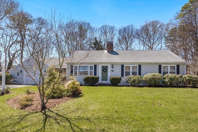 ranch-style house with a front yard, a chimney, and a shingled roof