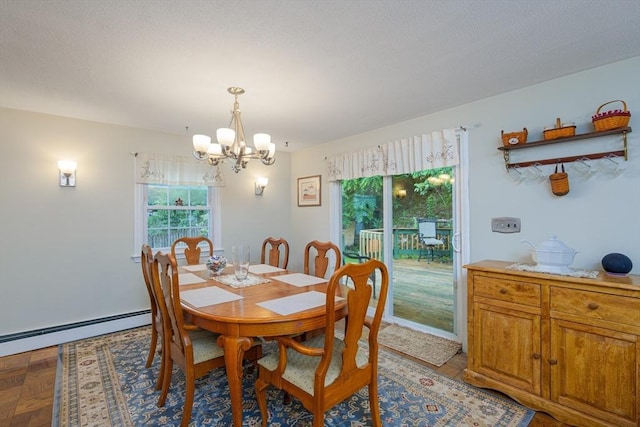 14 W Winkley St, Amesbury, MA 01913 - dining space featuring healthy amount of natural light, a chandelier, and baseboard heating