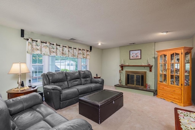 14 W Winkley St, Amesbury, MA 01913 - carpeted living room with a textured ceiling and a glass covered fireplace