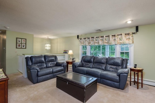 14 W Winkley St, Amesbury, MA 01913 - living area featuring carpet flooring, a textured ceiling, a baseboard heating unit, and plenty of natural light