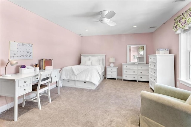 bedroom with light carpet, baseboards, visible vents, and a ceiling fan