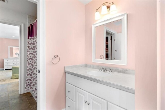 full bathroom with vanity and a shower with curtain