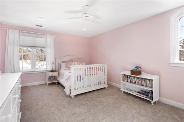 bedroom with a ceiling fan, recessed lighting, light carpet, and baseboards