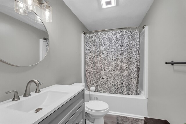 full bathroom with shower / tub combo with curtain, vanity, hardwood / wood-style floors, and toilet