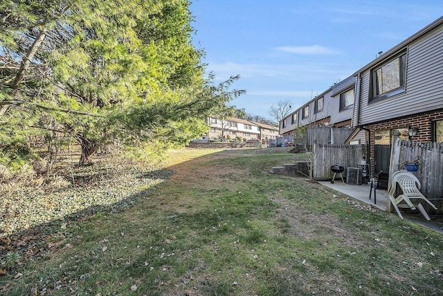 view of yard featuring a patio and cooling unit