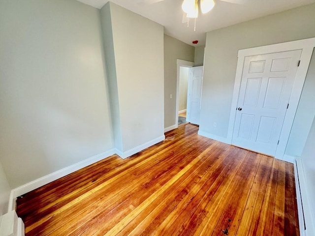 unfurnished bedroom with ceiling fan and light wood-type flooring