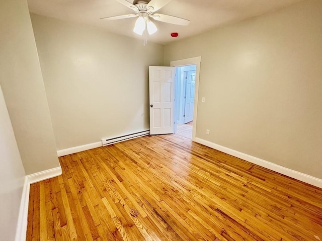 unfurnished room with light wood-type flooring, ceiling fan, and a baseboard radiator