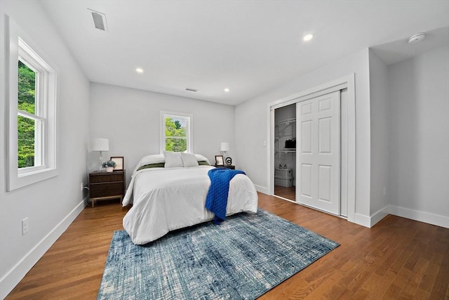 bedroom featuring hardwood / wood-style floors and a closet