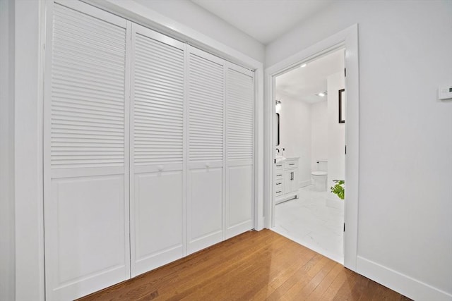 hallway with wood-type flooring