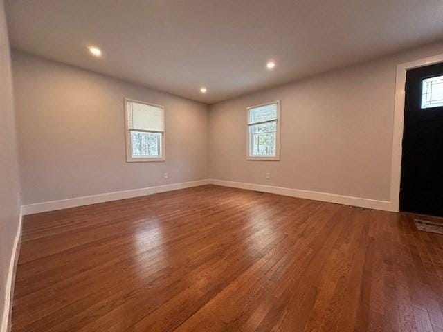 unfurnished room featuring dark hardwood / wood-style flooring