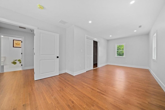 unfurnished room with light hardwood / wood-style flooring